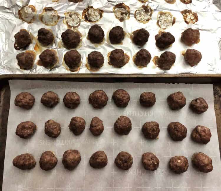 Meatballs being transferred to fresh parchment paper