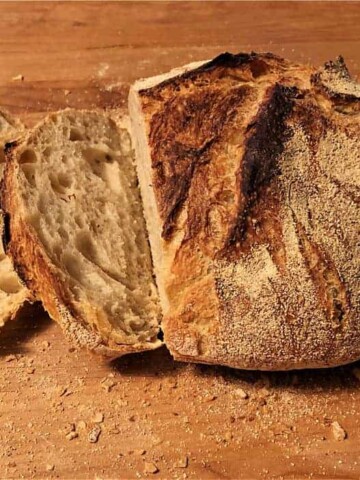 Dutch oven bread sliced on a cutting board