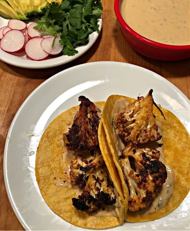 Corn tortilla with sauce and cauliflower, ready for garnishes