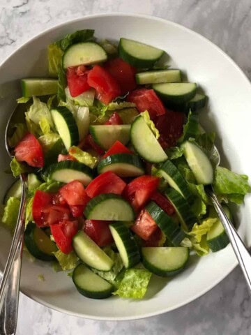 A simple salad dressed with oil and vinegar.