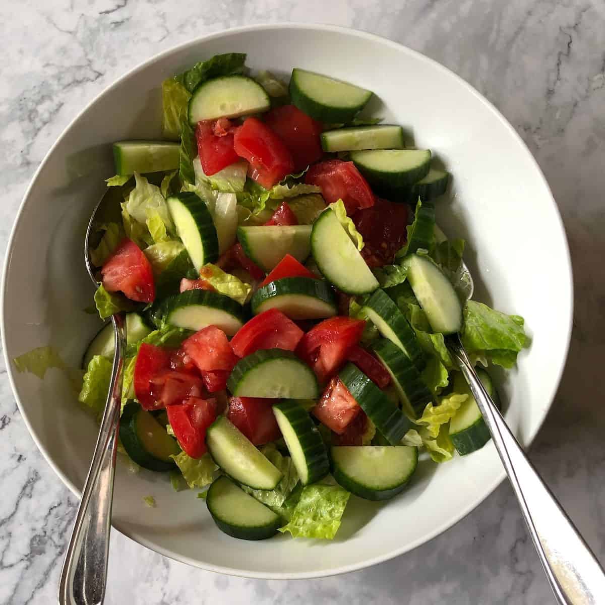 A simple salad dressed with oil and vinegar.