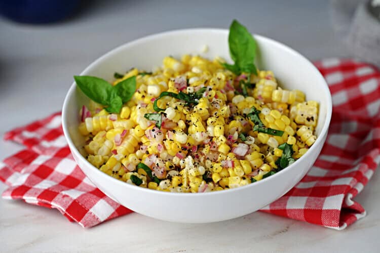a bowl of fresh corn salad ready to serve.