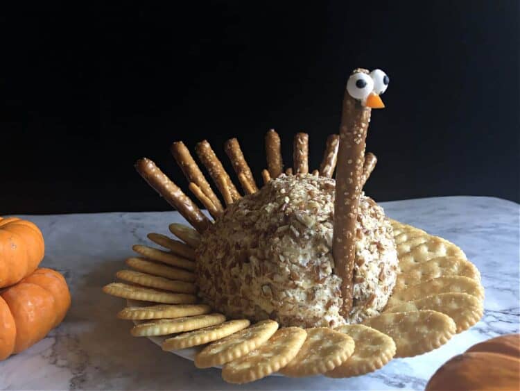 turkey cheese ball surrounded by crackers