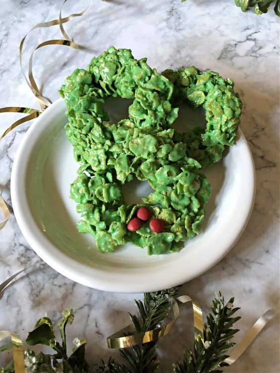 3 wreath cookies on a white plate