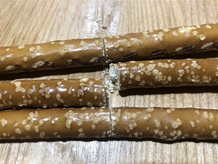 Cut the pretzel rods to the right length