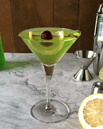 Midori Sour Martini with citrus and cocktail shaker
