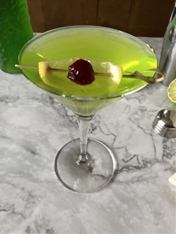 top down view of martini showing lemon and cherry garnish