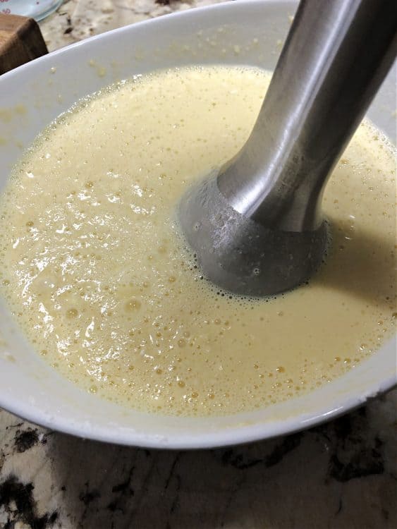 immersion blender in bowl of batter