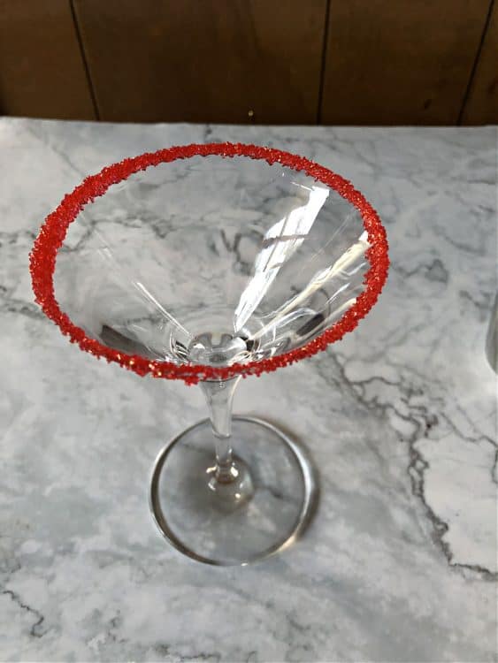 martini glass rimmed with red sugar