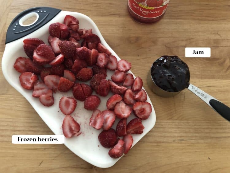 ingredients = frozen berries and jam, on a cutting board