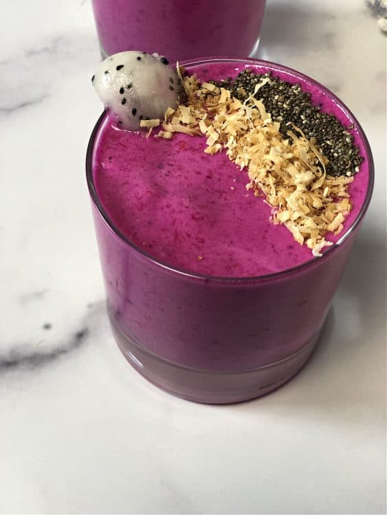 top down view of smoothie garnished with chia seeds and coconut