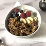 Keto granola in a bowl with yogurt and fruit