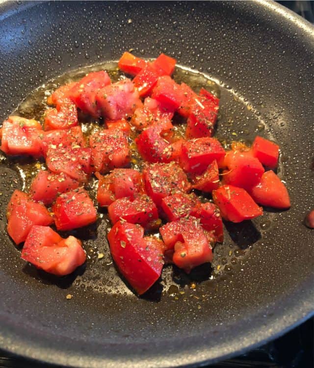 diced tomato in a skillet