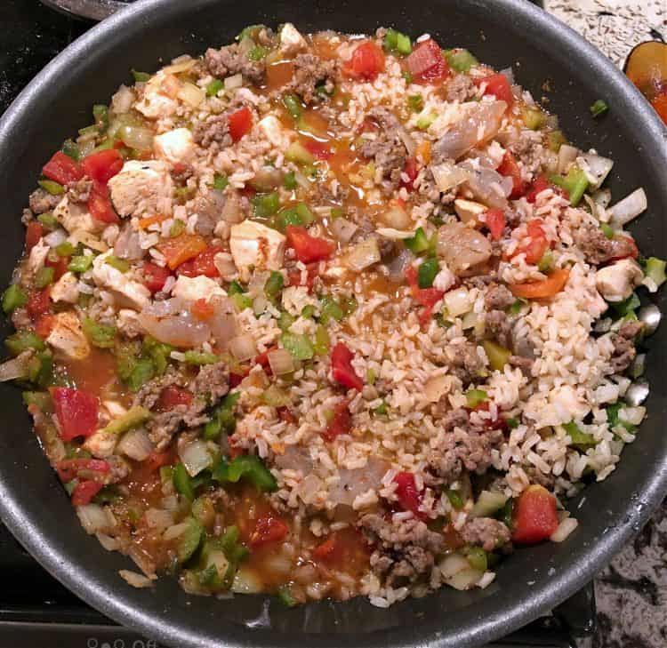 Jambalaya cooking in skillet