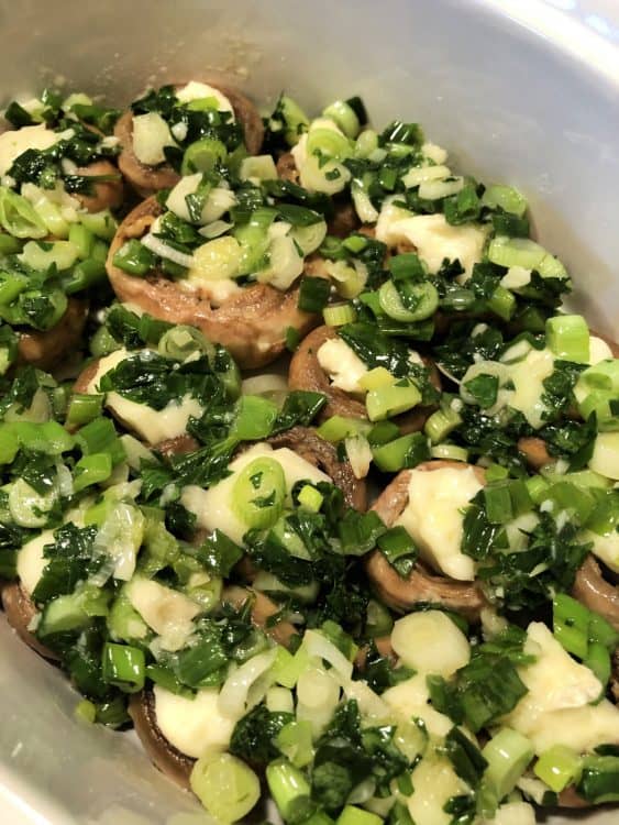 parsley topping spread over the mushrooms