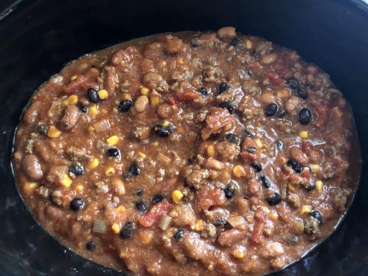 ingredients added to crock pot, ready to slow cook