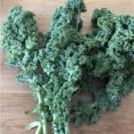 bunch of kale on a cutting board