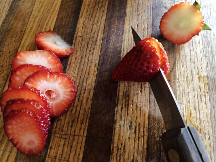 Slicing strawberry with a knife