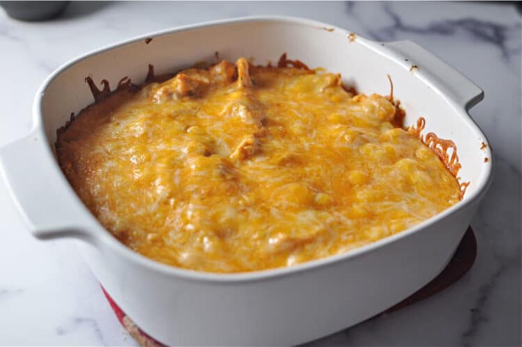 square baking dish containing cheesy casserole