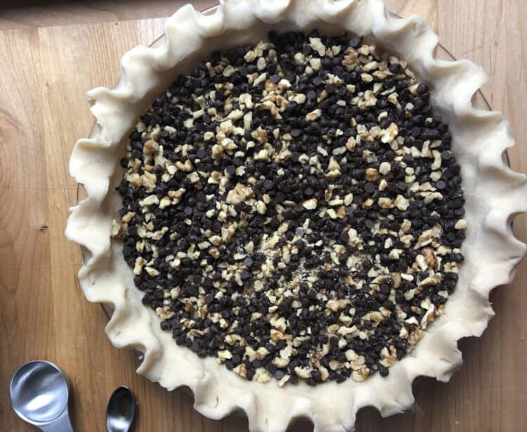 pie crust filled with chocolate walnut layer