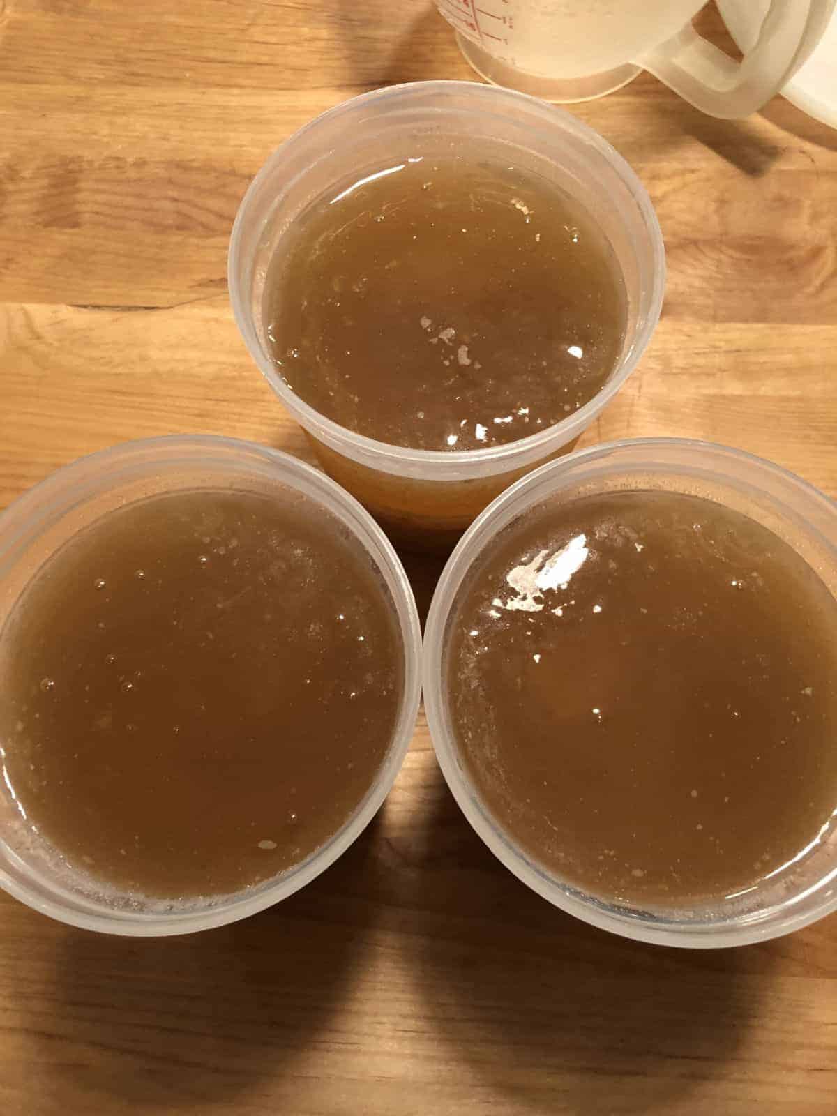 bone broth top down view in 3 jars.