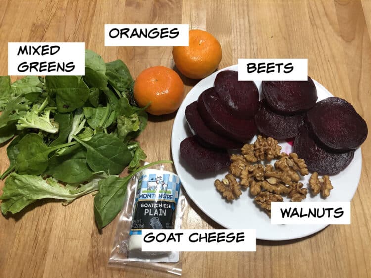 image of labeled ingredients: beets, oranges, mixed greens, walnuts and goat cheese