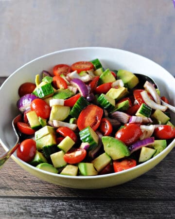 balsamic cucumber tomato salad in a serving bowl