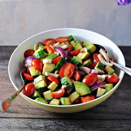 balsamic cucumber tomato salad in a serving bowl