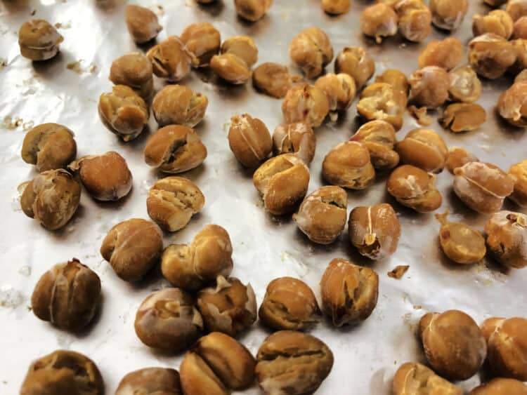 chickpeas on foil after dry roast step