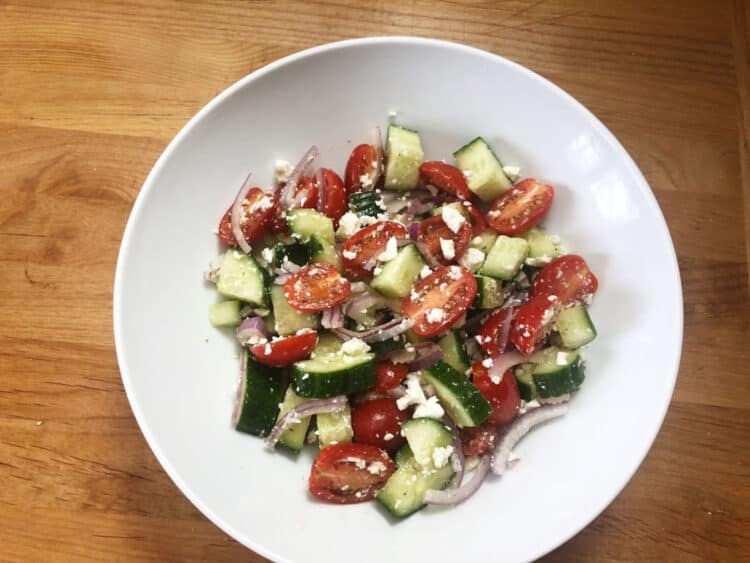 Greek salad with crumbled feta distributed