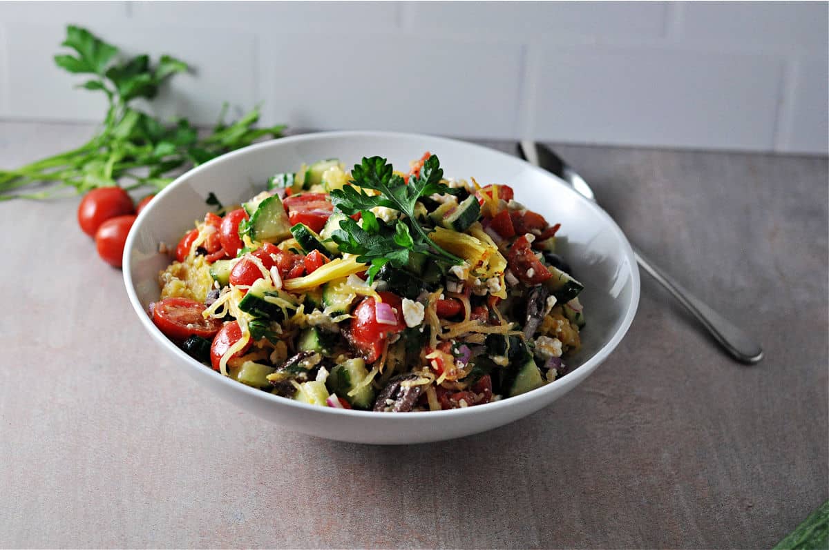 Bowl of Mediterranean spaghetti squash salad.