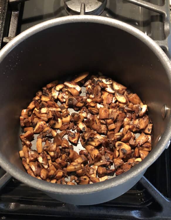 mushrooms cooking in a pot