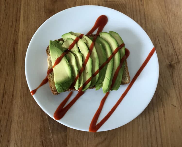 avocado toast with a drizzle of hot sauce