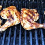 chicken legs on the grill also known as chicken quarters