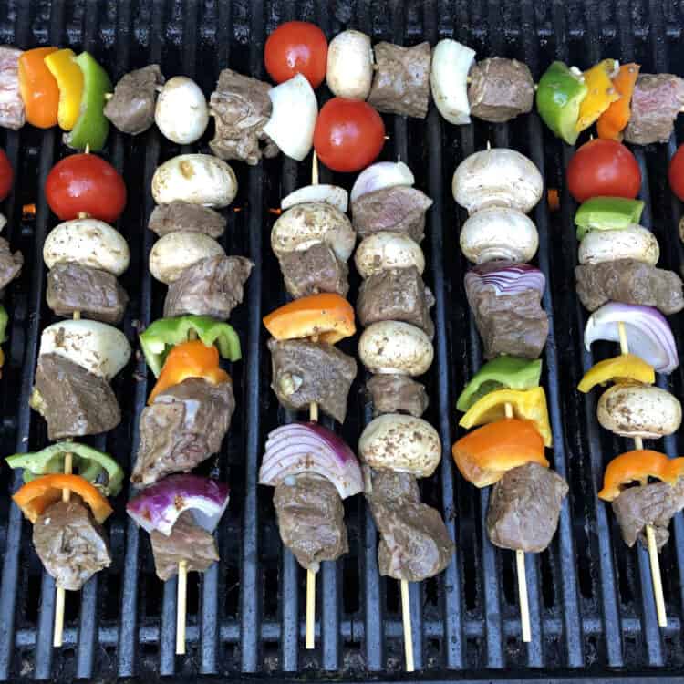 Beef or steak kabobs cooking on the grill