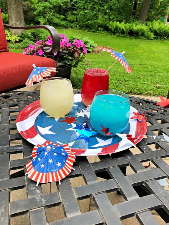 red white and blue slushes on a patriotic tray, outdoors on a patio table