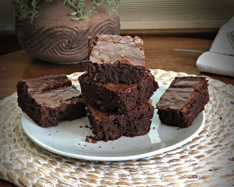 stack of brownies on a small white plate