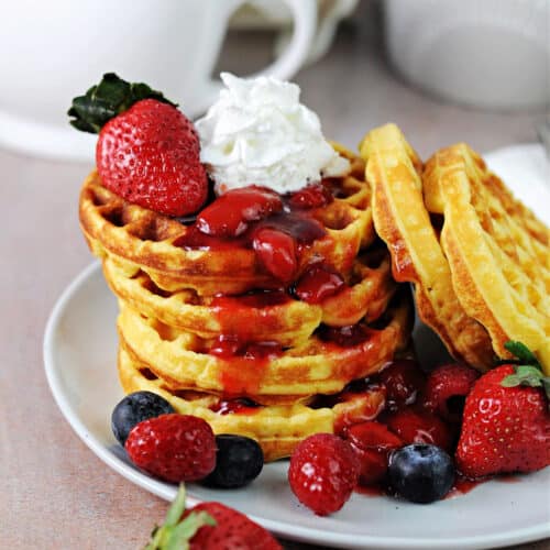 stack of keto breakfast waffles chaffles with fruit.