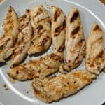 Close up of grilled chicken tenders.