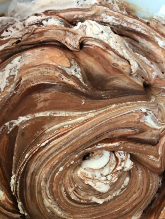 swirls of chocolate mixture and whipped cream in a bowl