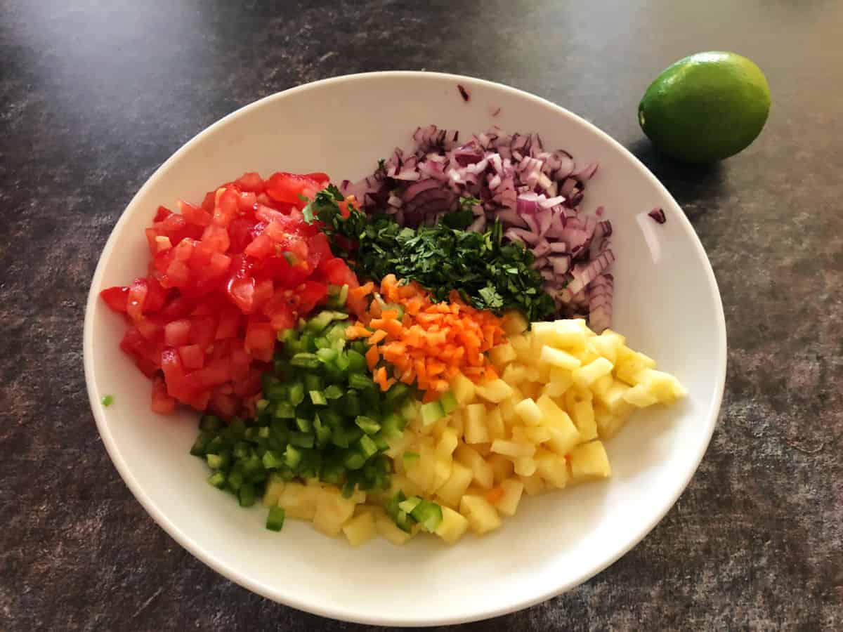 chopped  ingredients in a bowl, ready to be mixed.