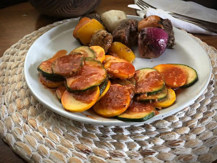 micrwaved zucchini and yellow squash on a white plate