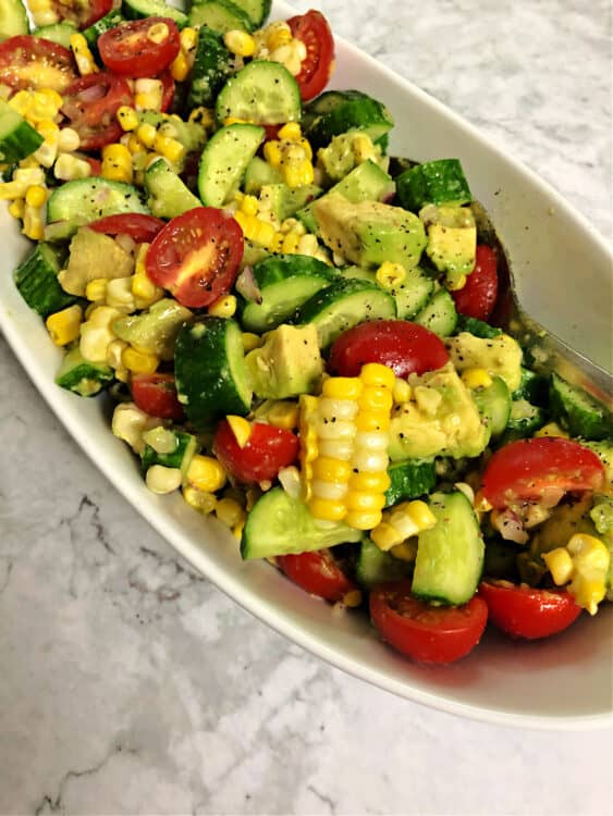 close up of corn tomato avocado salad