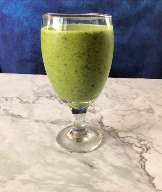 a glass of green smoothie  