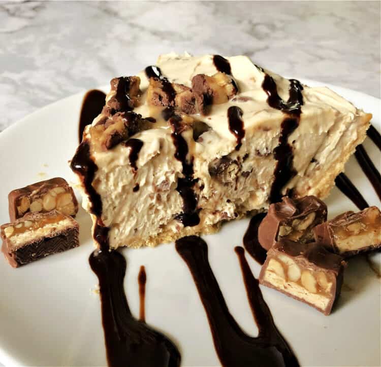 no bake snickers pie on a white plate