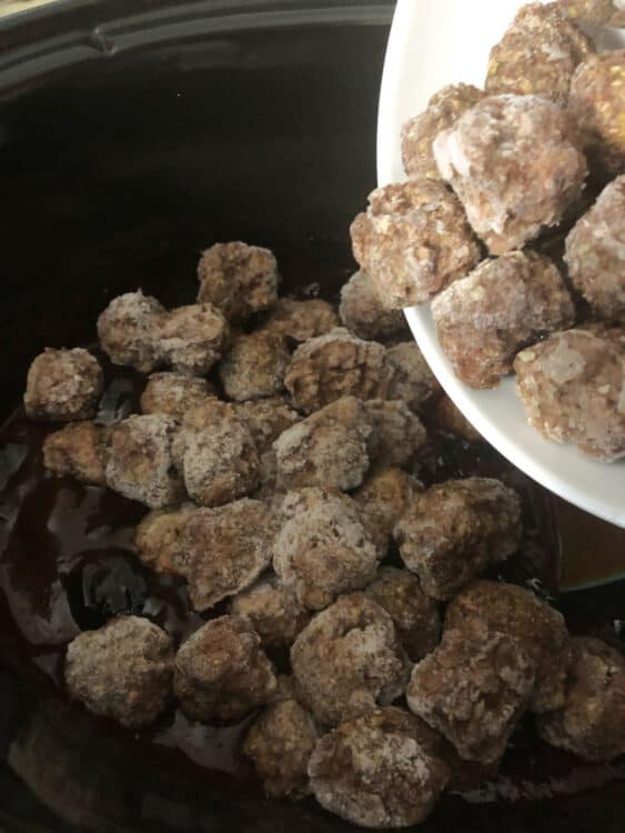 frozen meatballs pouring into crock