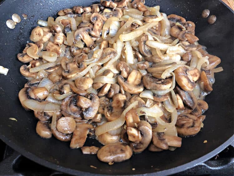 skillet of sauteed mushrooms and onions