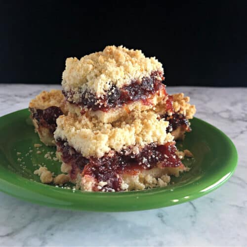 stack of cranberry sauce bars on a small green plate