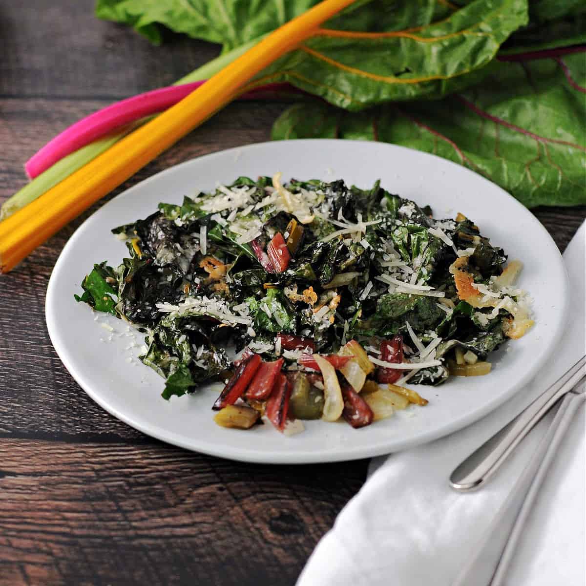 roasted swiss chard on a white plate ready to eat