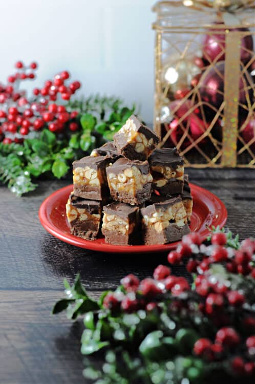 Snickers fudge stacked on a small red plate